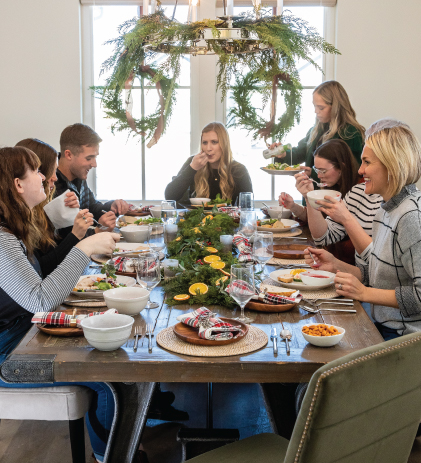 friends giving gathered table scape holiday dinner