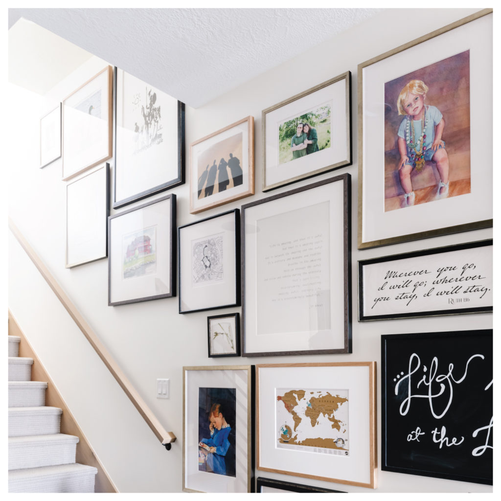 Gallery wall stair well mud room